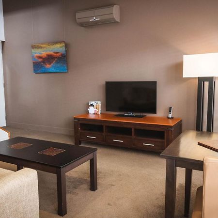 The Henry Jones Art Hotel Hobart Exterior photo A living room in a typical apartment at the Village at Grand Traverse Commons