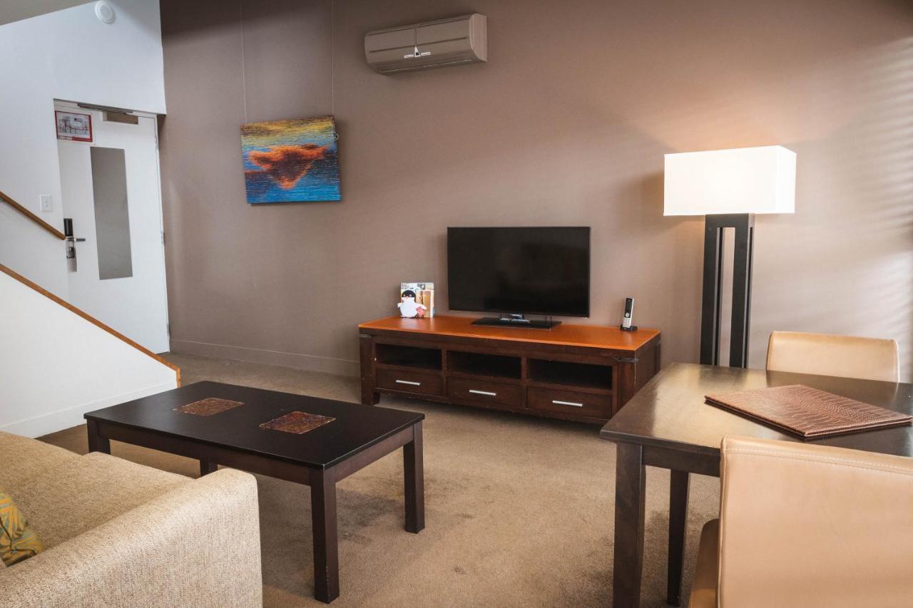 The Henry Jones Art Hotel Hobart Exterior photo A living room in a typical apartment at the Village at Grand Traverse Commons