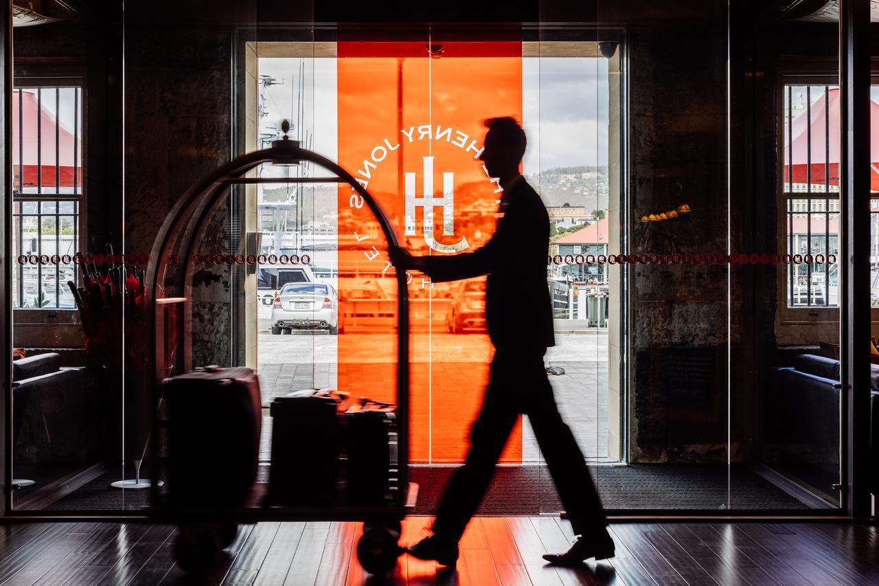 The Henry Jones Art Hotel Hobart Exterior photo A doorman at the entrance of a hotel